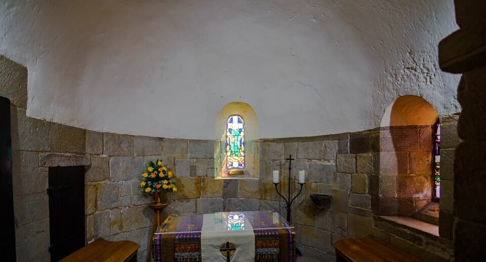 Stone interior and stained glass in St Margaret’s Chapel at Edinburgh Castle